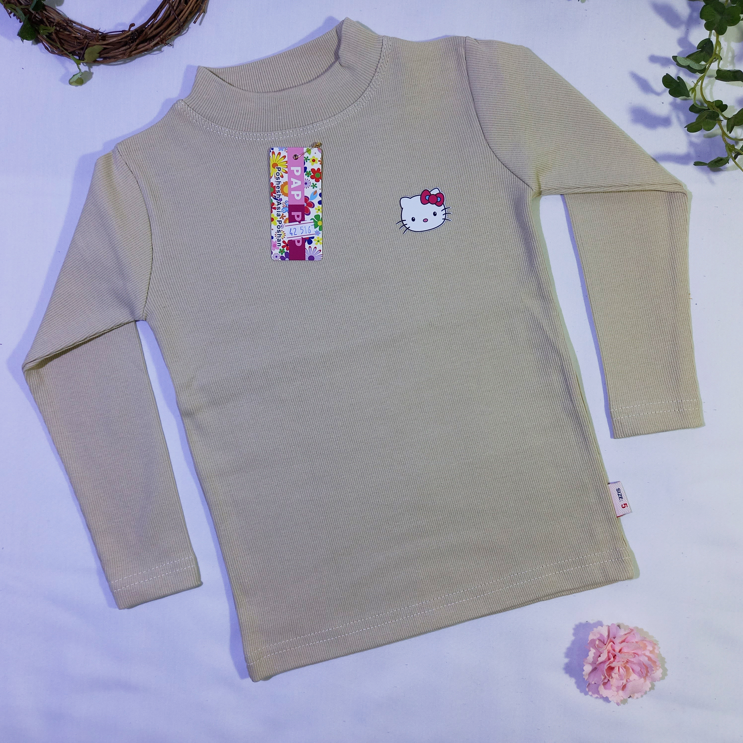 بلوز کبریتی آستین بلند دخترانه طرح کیتی رنگ کرمی سایز 40، 45 کد1023